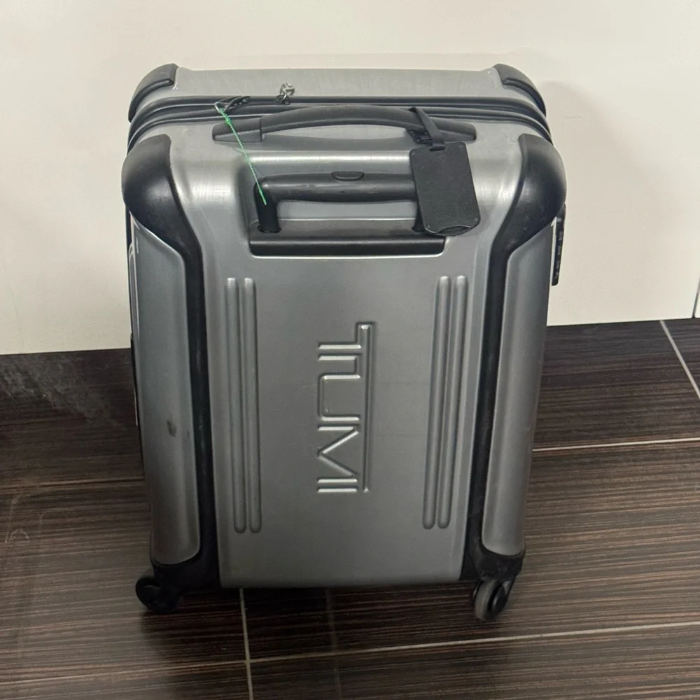 Tumi Vapor Silver and Black Hardside Spinner Carry-On